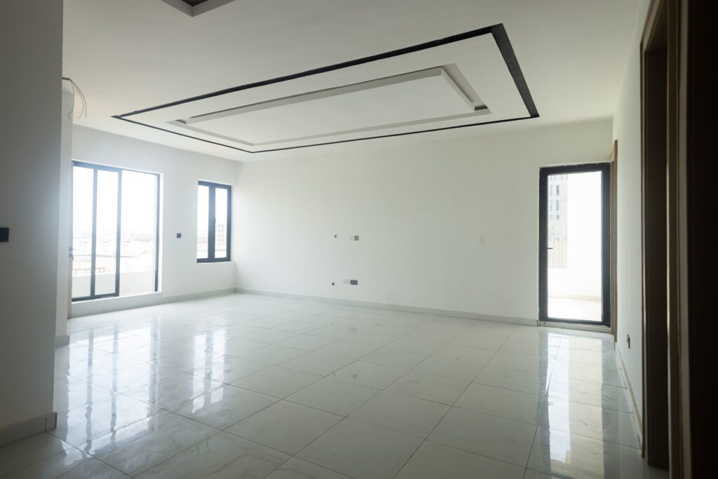 Brum Height 4: Living room with large windows and a recessed ceiling
